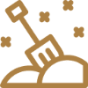 Shovel in sand with stars background.